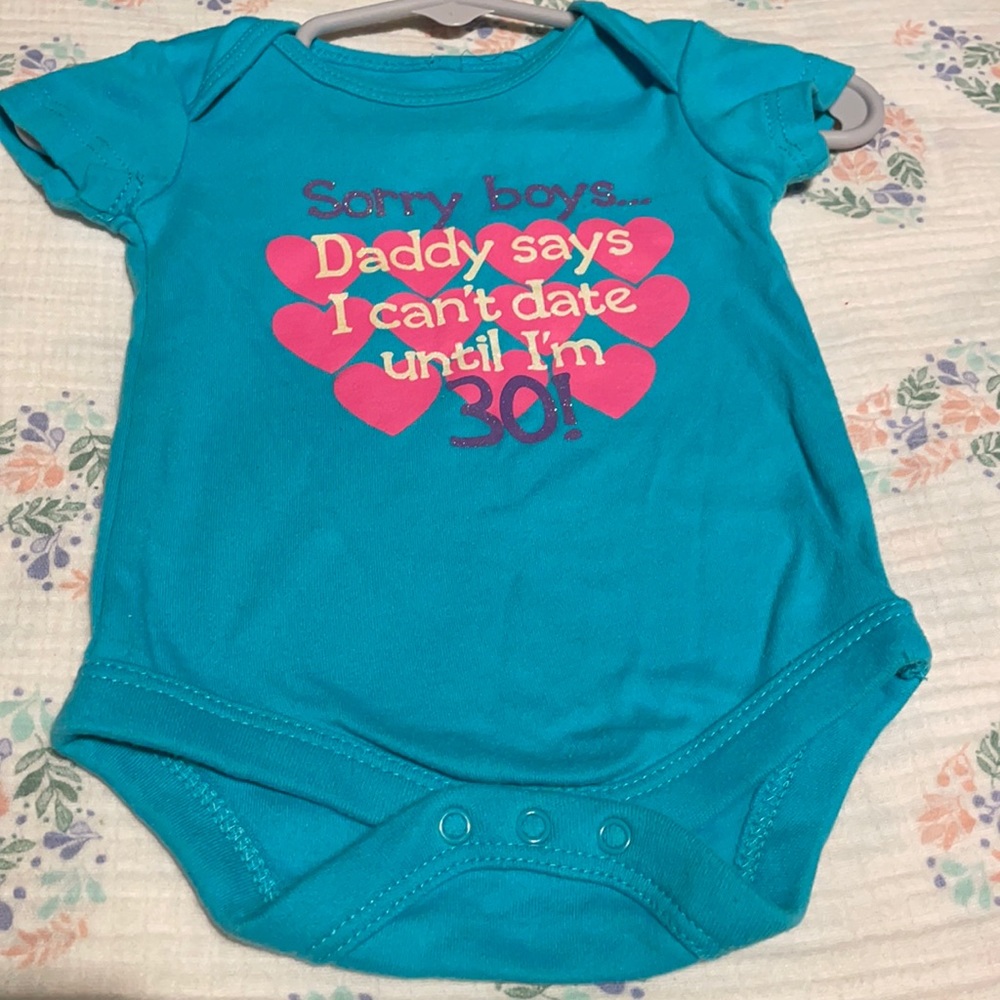 Blue onesie with pink hearts